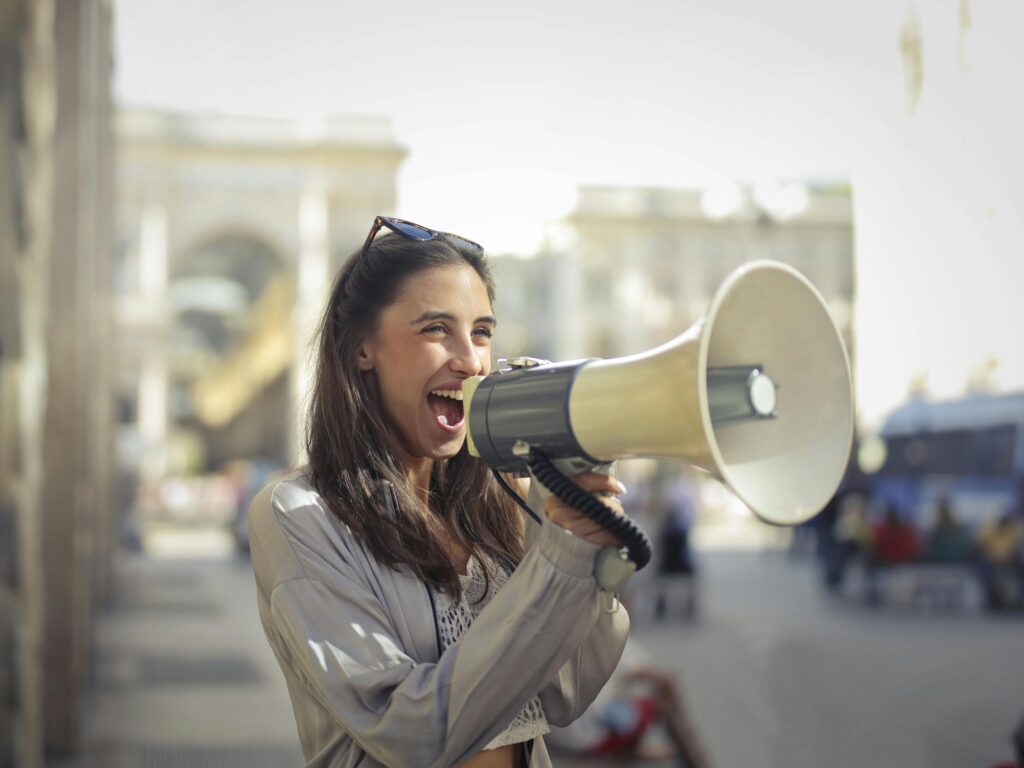 young woman with a speakerphone